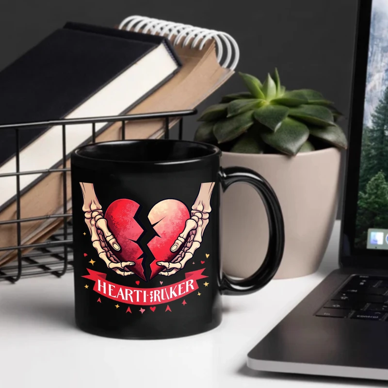 Heartbreak coffee mug, black skeleton hand holding a broken heart design, complete with a red banner and text, suitable for Hall