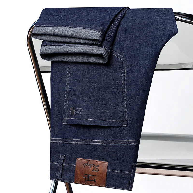 Celana Jeans Denim Stretch Kaki Lurus Warna Solid Mode Baru Musim Semi dan Musim Gugur Celana Berkualitas Tinggi Nyaman dan Longgar untuk Pria