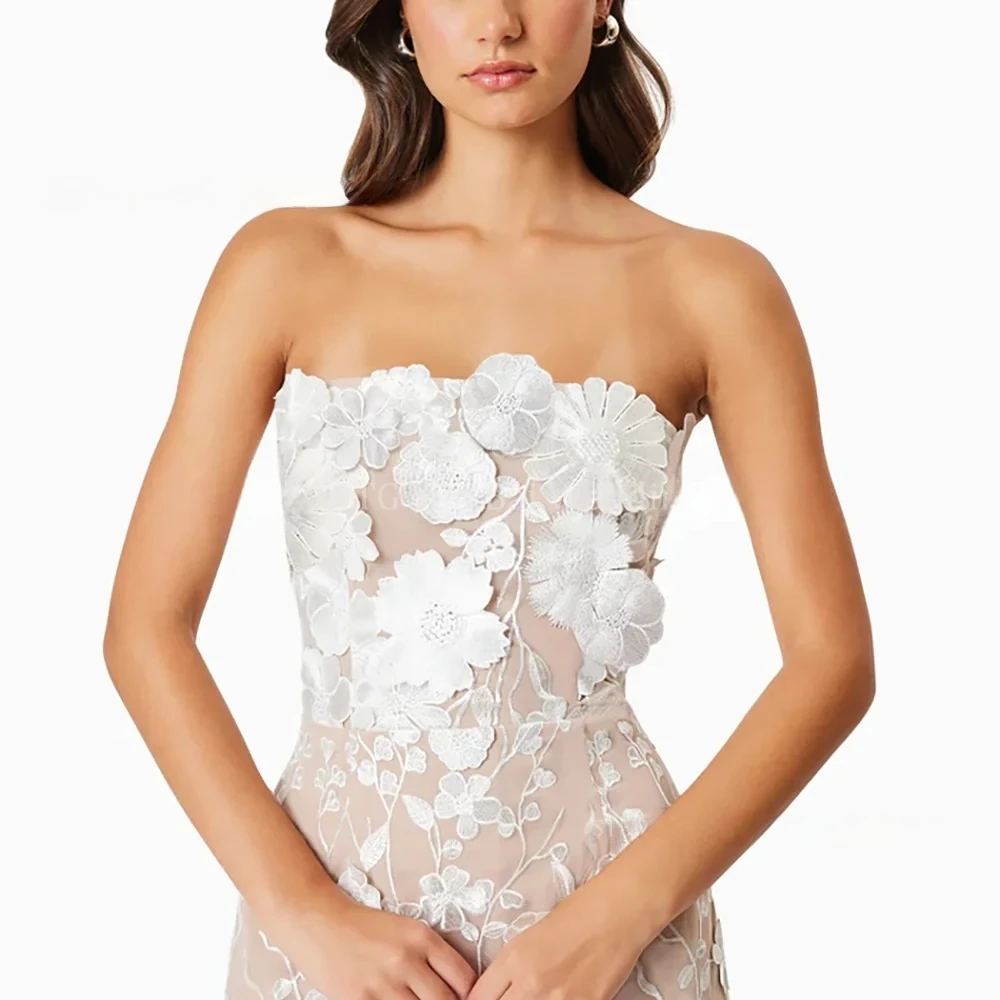 فساتين حفلة موسيقية من الدانتيل على شكل زهرة بيضاء للنساء بدون حمالات بطول الشاي مستقيمة لحفلات أعياد الميلاد حسب الطلب