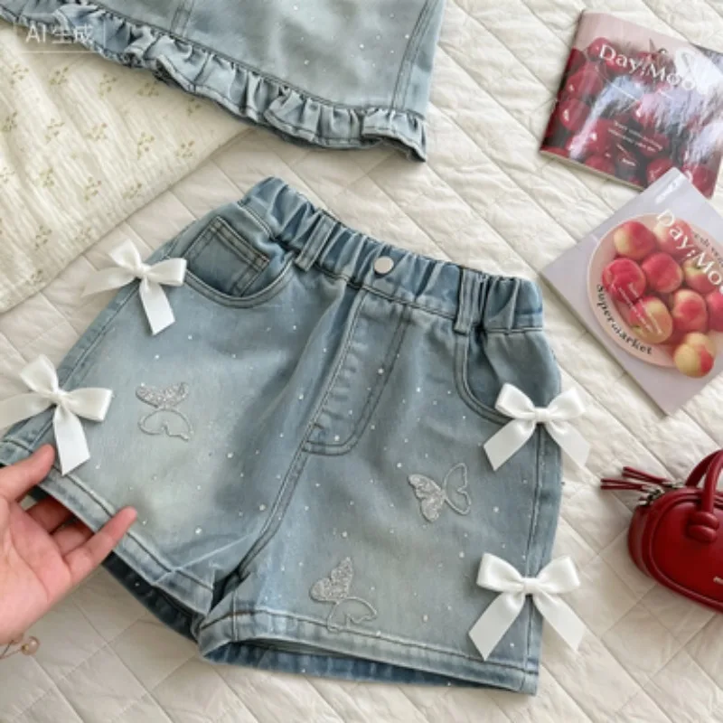 2026 Girls Summer Soft Stone Grinding Spray White Design Shorts Childrens Full Diamond Butterfly Jeans Fashionable Stylish