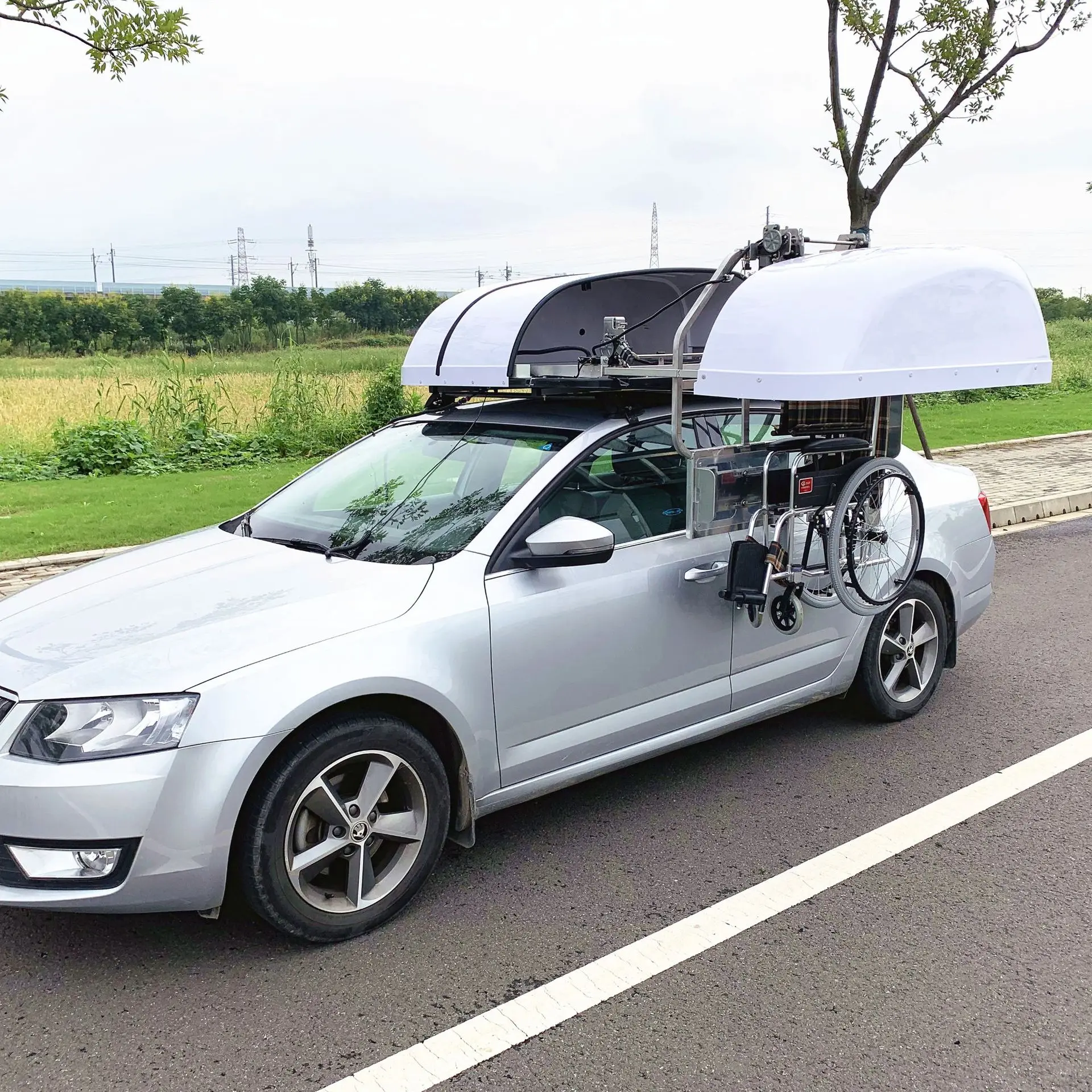 The main driver of the car operates the electric wheelchair storage box.