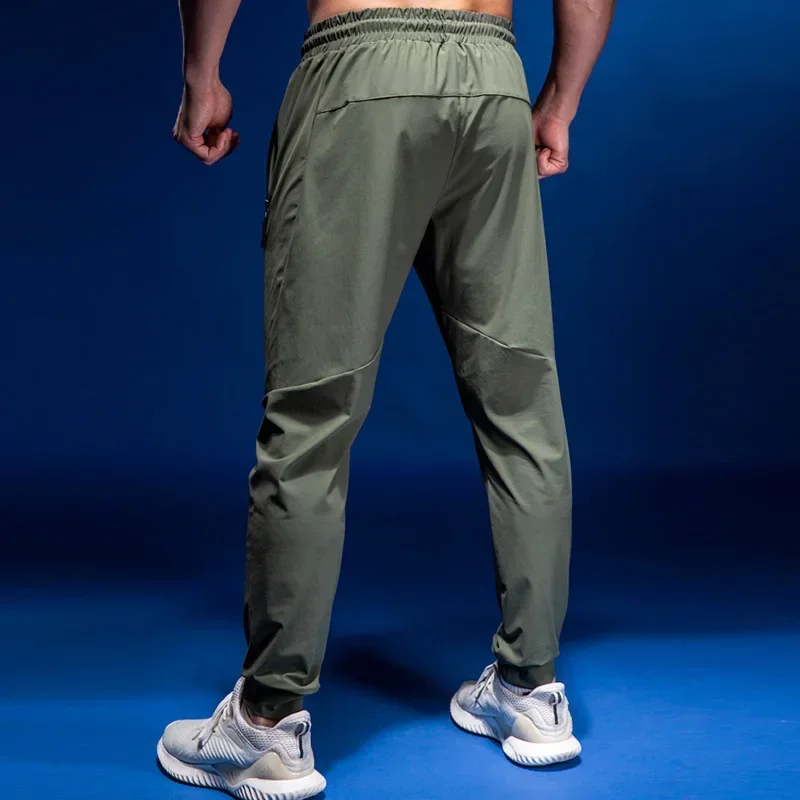 

2024 Mens Joggers Casual Pants Fitness Men Sportswear Tracksuit Bottoms Skinny Sweatpants Trousers Gyms Elastic Pants