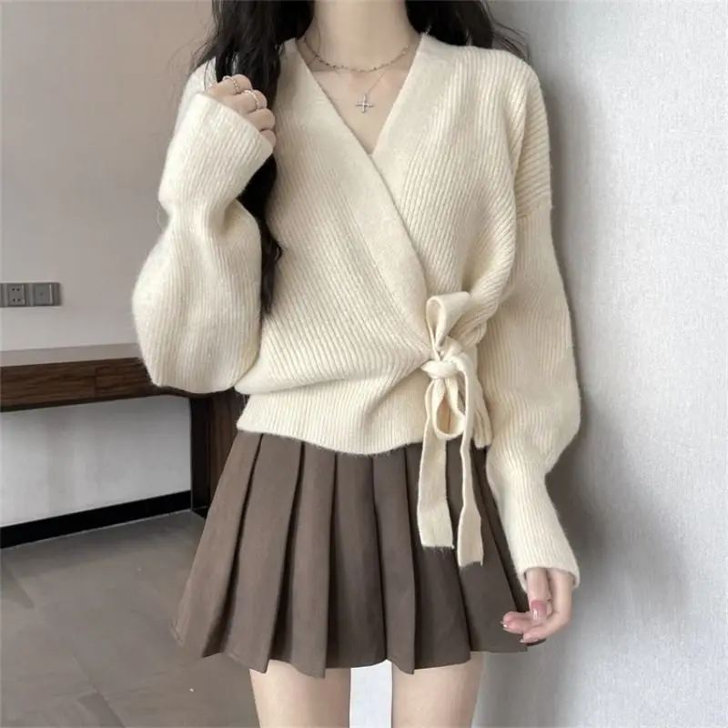 Cross shaped irregular strap waist slimming sweater cardigan women in autumn and winter chic lantern sleeve loose knit sweater