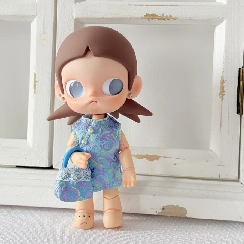 The charming Zsiga figurine is beloved for its unique features. BJD doll, a girl with a collar, wearing a traditional Chinese-st