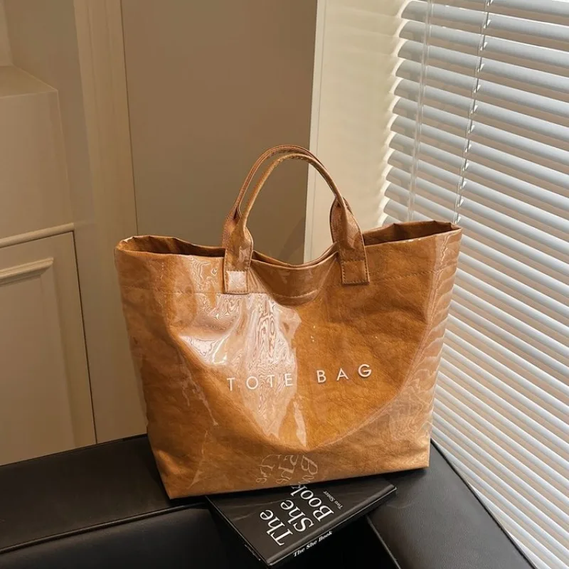 

Американская легкая роскошная сумка, универсальность ручной переноски для летних поездок на работу женщин