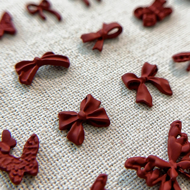 50 Uds. De abalorios para uñas con lazo de resina de color rojo vino, mezcla de tamaños a granel, cinta 3D con lazo, Mini accesorios Kawaii para decoración de uñas, decoraciones para uñas bonitas DIY