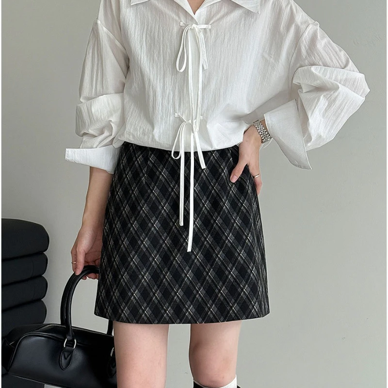Modna spódnica wełniana w kratę z wysokim stanem w stylu uniwersyteckim na jesień 2025 dla kobiet