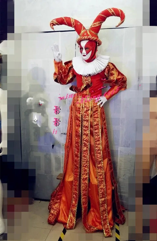 

Stilts clown costume is decorated with orange national printed fabric and gold thread.