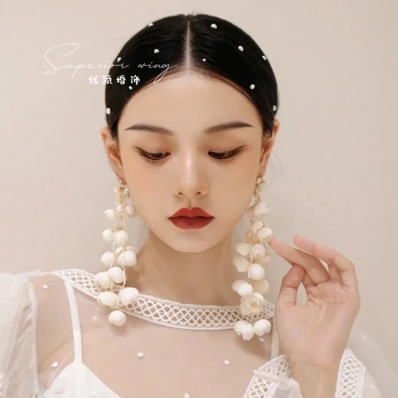 Korean gentle senior sense exquisite Lily of the valley bud handmade white tassel extra long flower earring bridal accessories