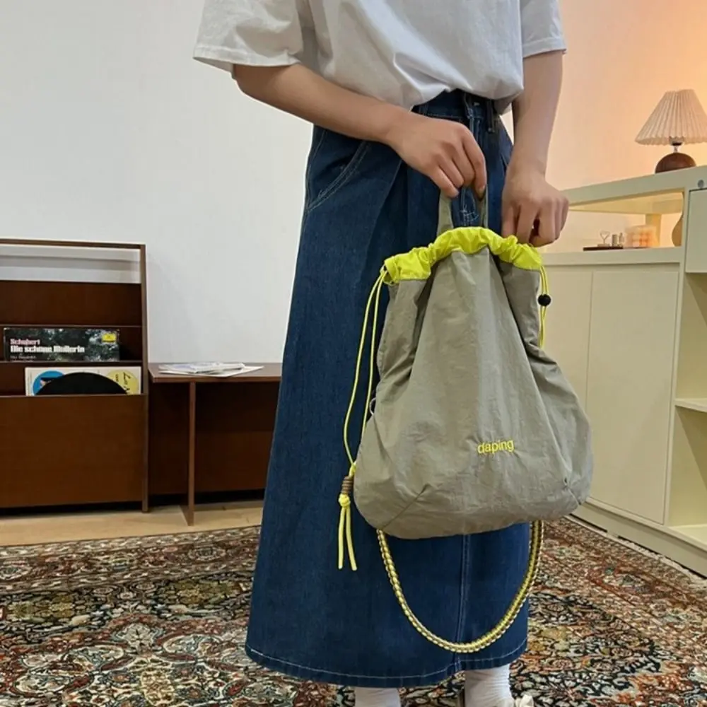 

Casual Lightweight Shoulder Bag Letter Commute Crossbody Bag Large Capacity Nylon Drawstring Bag Unisex