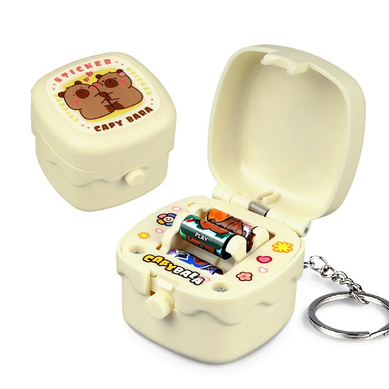 Mini macchina per adesivi creativi scatola a sorpresa giocattoli di decompressione portachiavi divertente macchina per adesivi rotanti ciondolo per zainetto regalo per ragazza