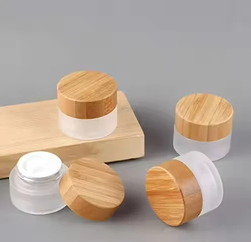 

Cosmetic Face CreamGlass Containers Glass with Custom Lid CBD hemp Face cream Eye cream Glass Jar with Bamboo Lid cosmetic cream