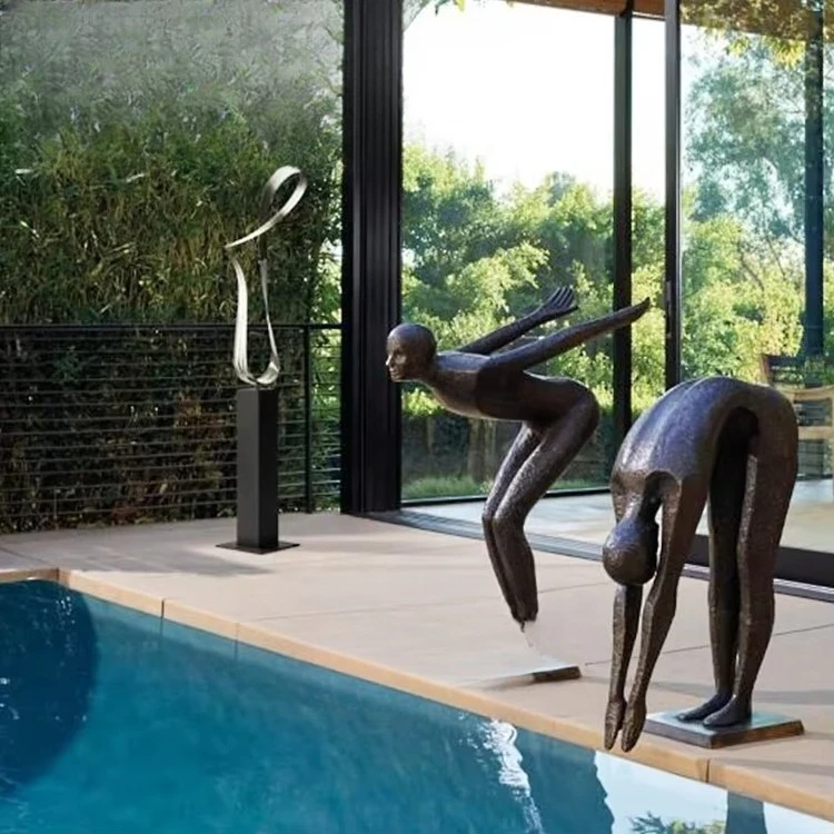 Modern outdoor swimming pool decorated with metal diving sculpture