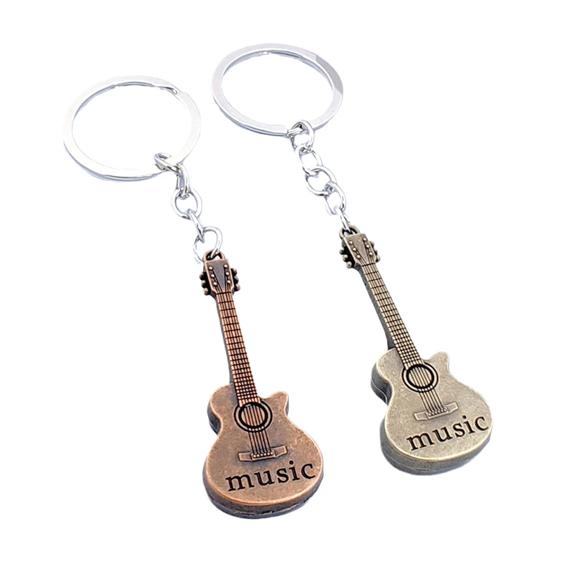 

1/2 шт. новая мода ретро музыкальная гитара креативный брелок для мужчин женская металлическая сумка автомобильный брелок кулон трансграничные ювелирные изделия