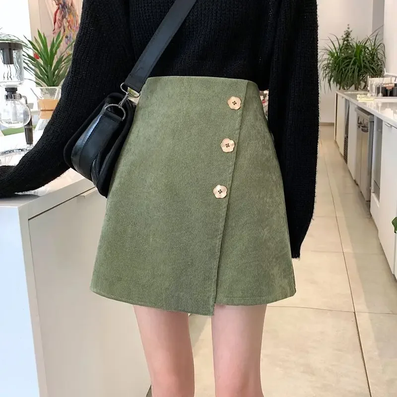 

Petal button irregular skirt women's autumn and winter new fashion Joker corduroy pit A-line skirt with safety pants.