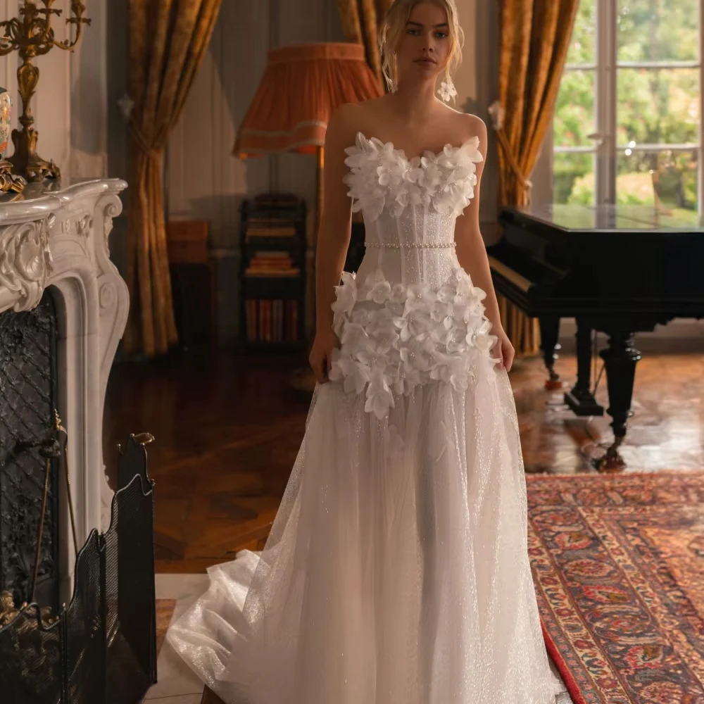 Aangepaste glitter 3D bloemen trouwjurk voor vrouw bruid elegante dromerige strapless bruidsjurk 2026 mouwloze bruidsjurk