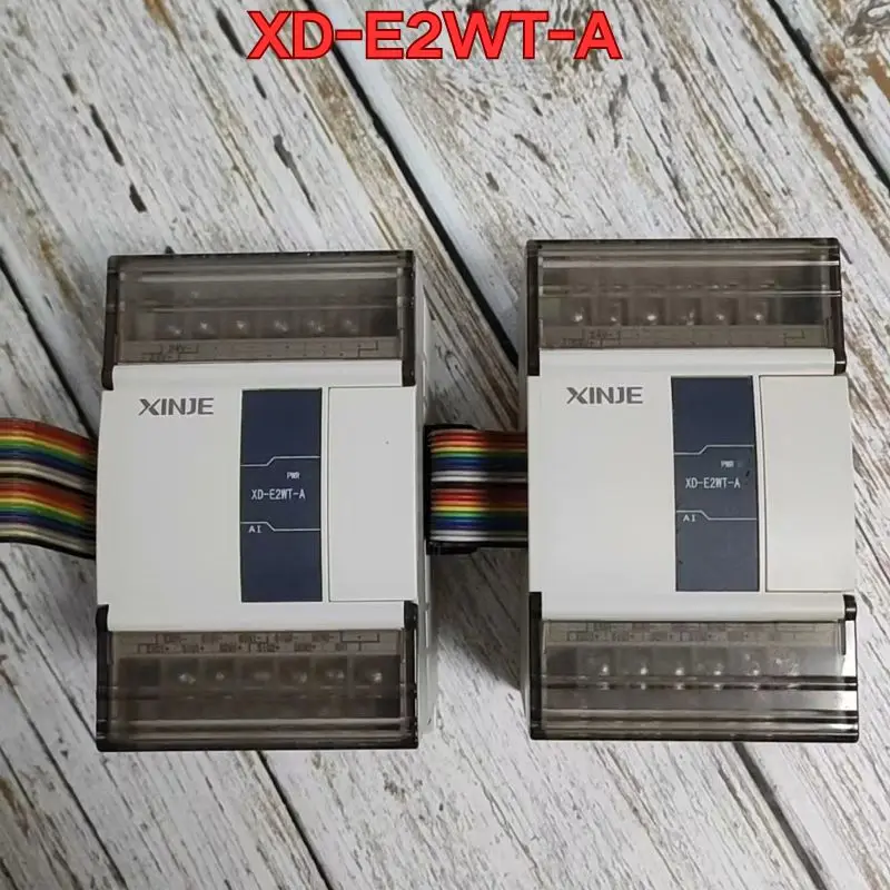 Second-hand PLC module XD-E2WT-A  function test is normal Original authentic Latest Pricing for 2026