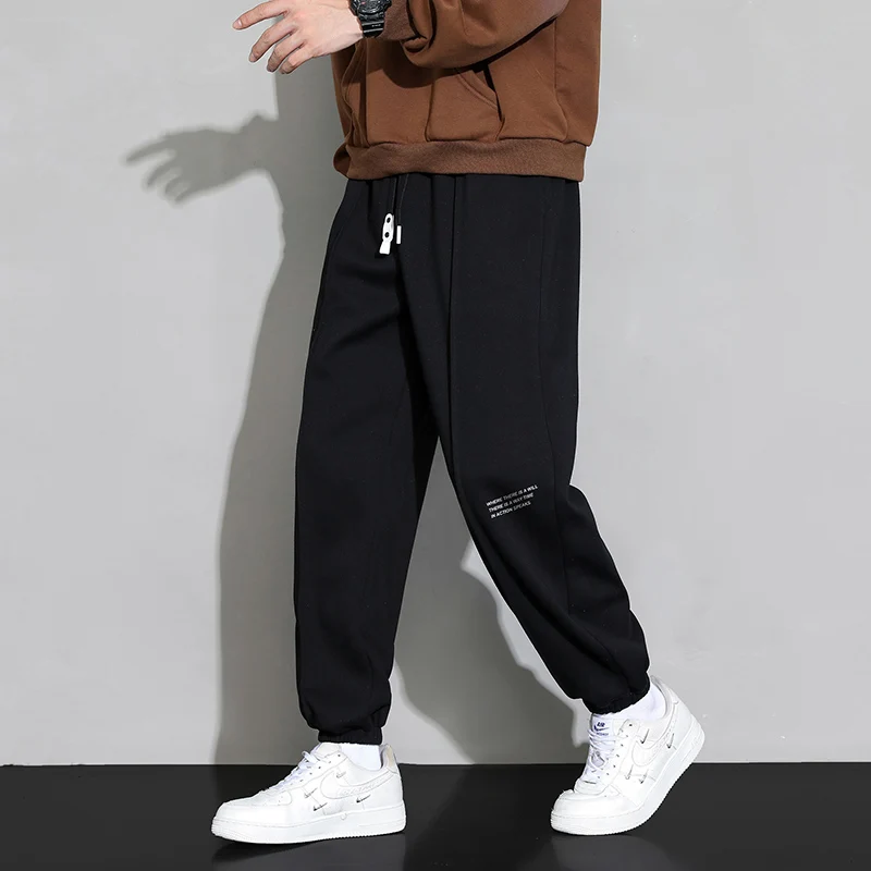 2024 Autumn and Winter Men's Elastic Waist Panel Pocket Letter Fashion Solid Color Tie Feet Loose Sports Versatile Casual Pants