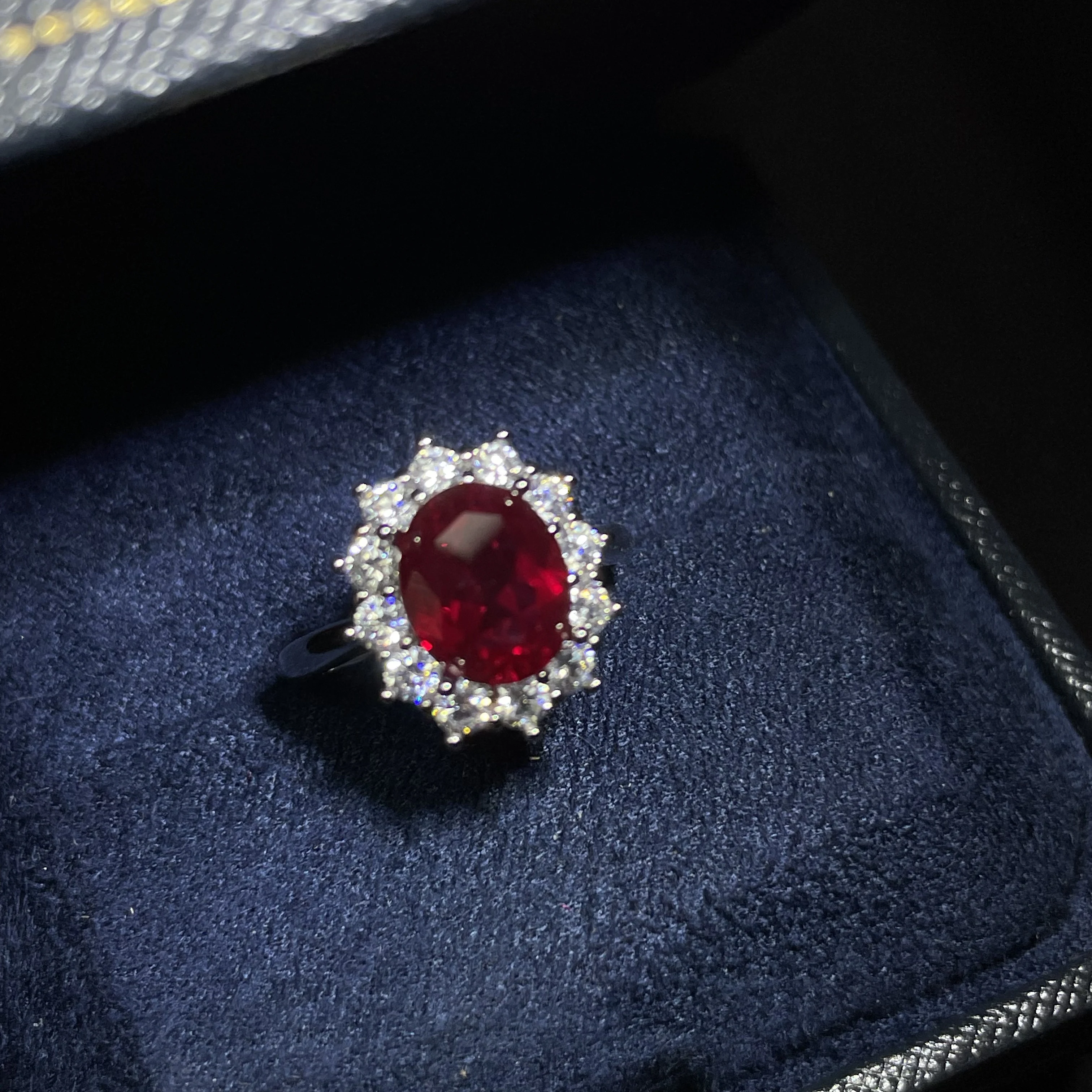 Pigeon-blood red ruby engagement ring with sunflower design - a must-have for light luxury and niche weddings