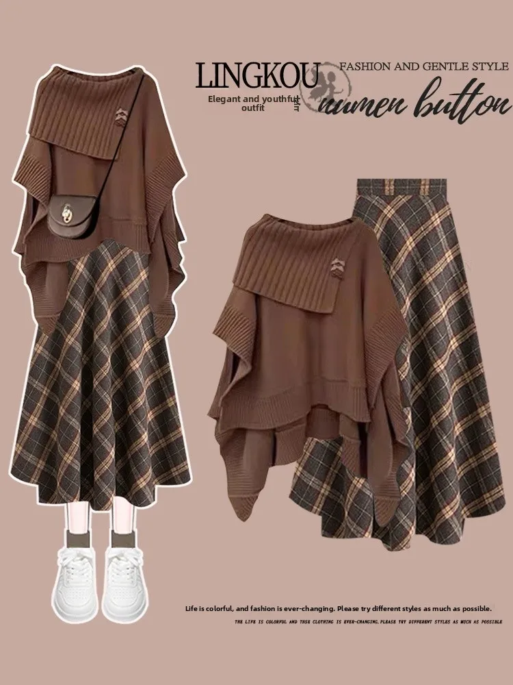 

Комплект: вязаный свитер большого размера и клетчатая юбка миди с высокой талией. Осенний повседневный модный наряд.