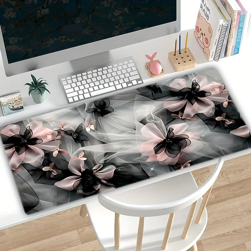 

The bow-patterned rectangular mouse pad made of natural rubber is durable and anti-slip, suitable for gamers and home use