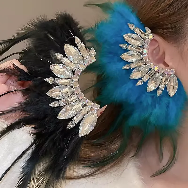 

Acrylic crystal feather tasseled earrings are a single-piece design with a bohemian, luxury, and high-end look.