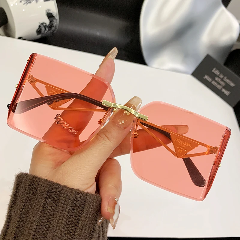 2025 New Frameless Edge Curved High-end Sense Women's Sunglasses Metal Inverted Triangle Decorative Glasses Men 90310