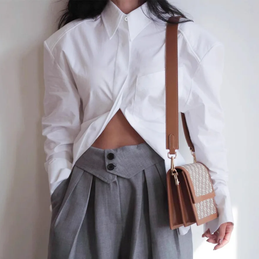 Bangniweigou-Camiseta blanca elegante con recortes dibujados y espalda descubierta para mujer, camisa de manga larga con una botonadura