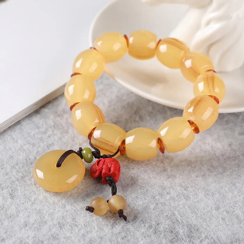 Tibetan-style sheep bracelet a unique souvenir made of synthetic resin featuring a cow horn design and includes a Buddhi
