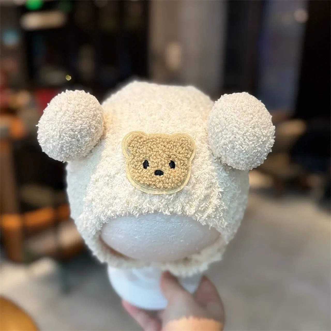 

Cute Plush Ball Baby Hat Cartoon Bear Plush Beanie Cap with Earmuff Winter Warm Solid Color Kids Ear Protection Cap