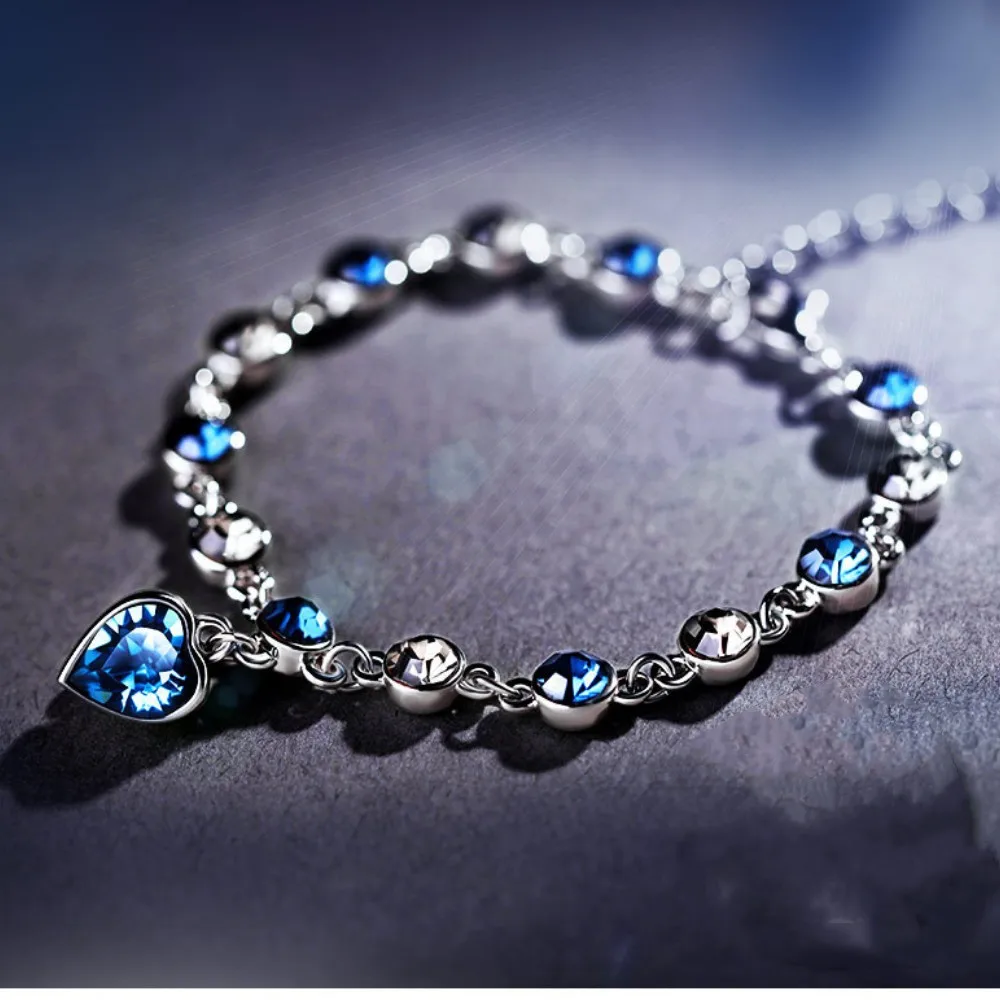 สร้อยข้อมือผู้หญิงสีเงิน สร้อยข้อมือนำโชคประดับคริสตัลสีฟ้ารูปหัวใจ สร้อยข้อมือสำหรับเจ้าสาว งานแต่งงาน งานหมั้น ของขวัญเครื่องประดับชั้นดี