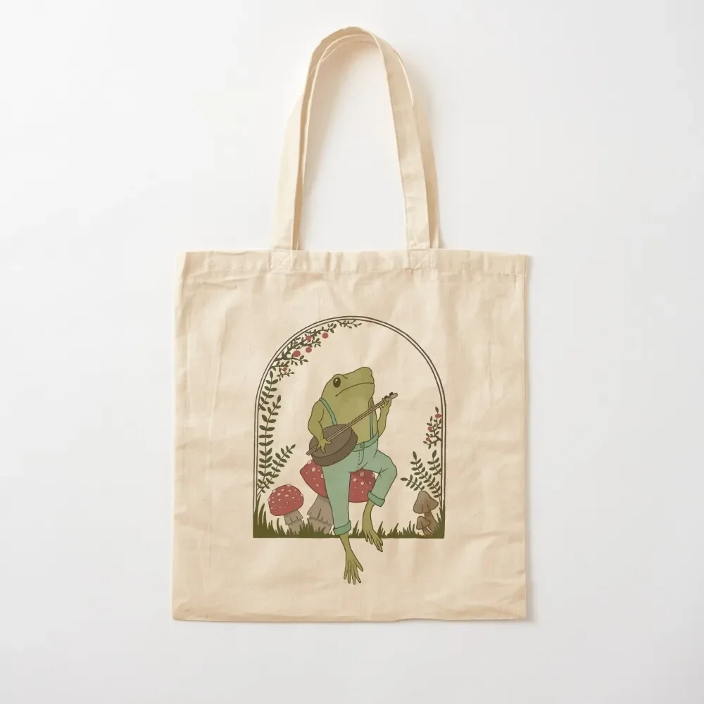 

Cottagecore Aesthetic Frog Playing Banjo on Mushroom: Cute Vintage Goblincore Farmer Toad in Garden, Emo Grunge Fairyco Tote Bag