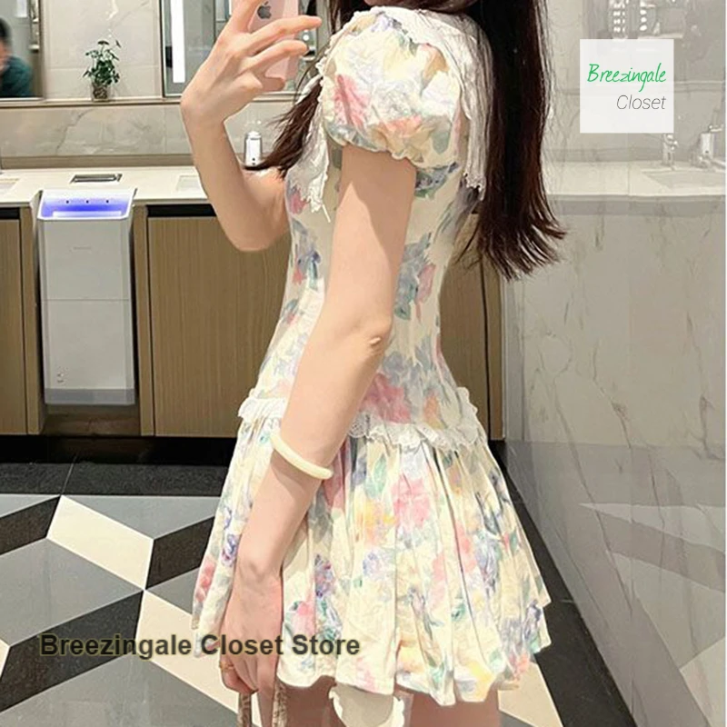 French pure wind design doll collar dress female summer square collar new sweet hollow floral temperament bubble sleeve skirt.