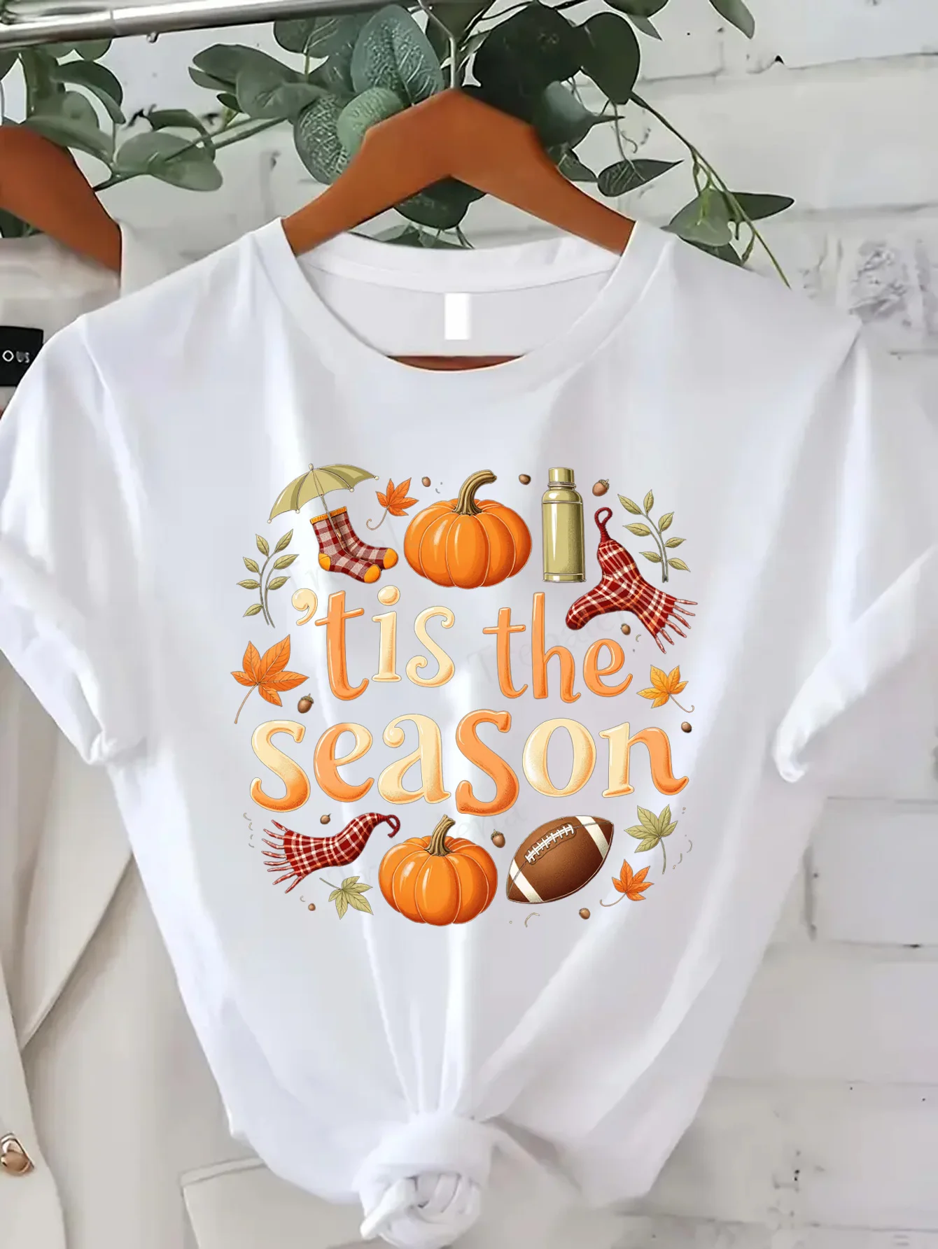 

Comfortable Women's Print T-shirt "Autumn 'Tis the Season T-Shirt with Pumpkins, Leaves & Football Print"