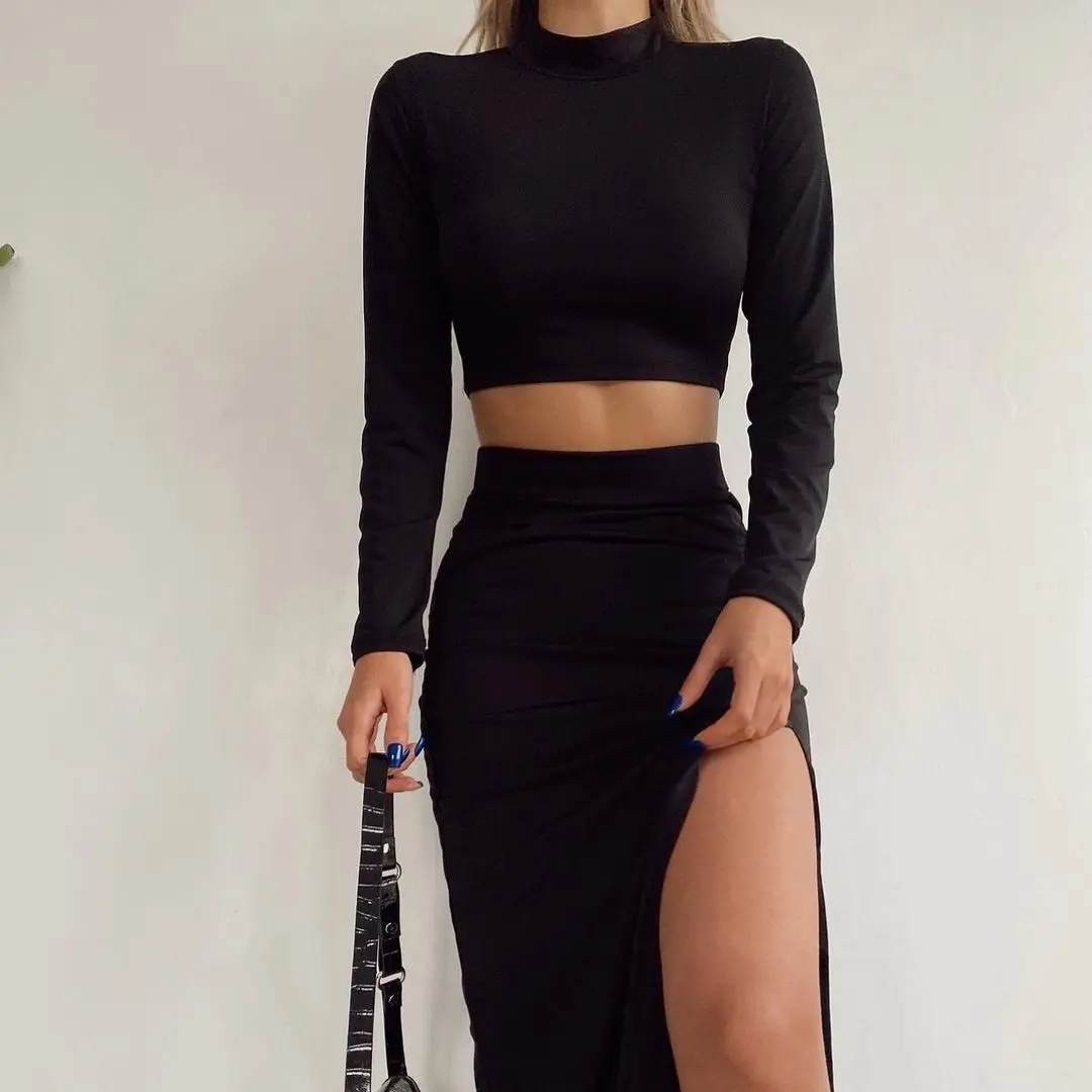 Europa y América otoño nuevo sexy ajustado ombligo de manga larga top bolso dividido falda a la cadera traje modelos de mujer