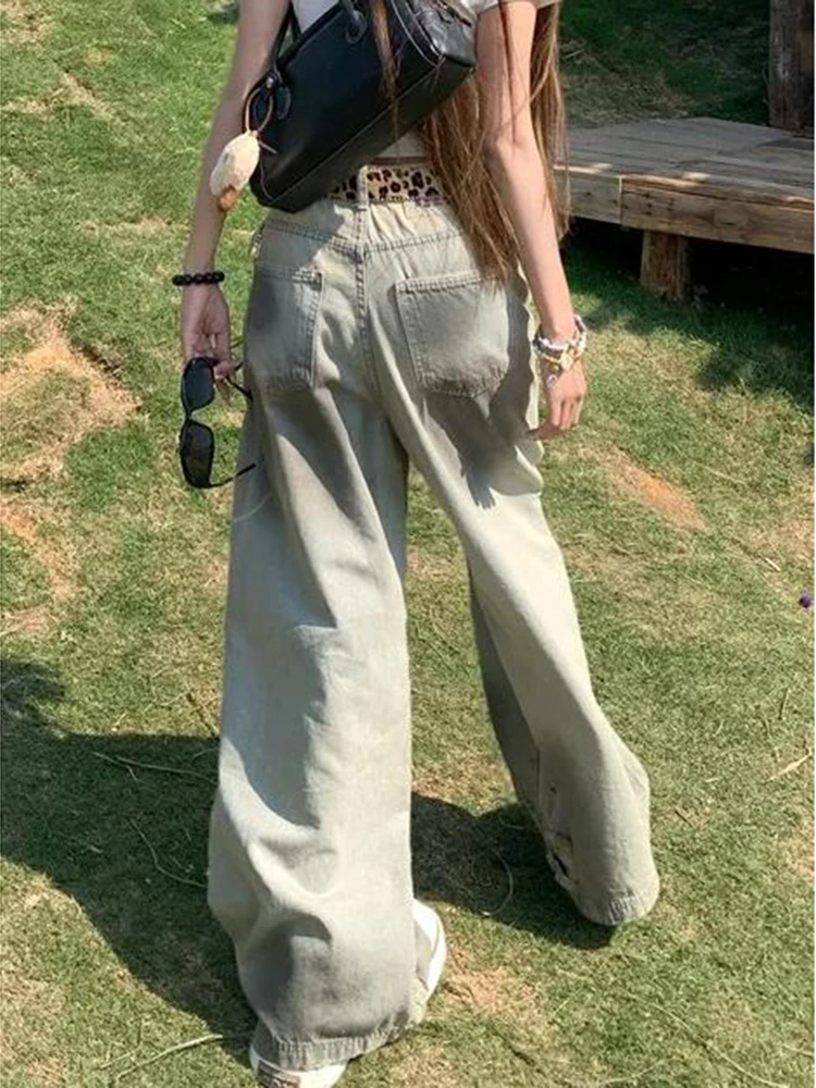 Amerikaanse stijl retro noodlijdende gele modder vuile geverfde jeans dames lente herfst 2025, ontwerpgevoel gescheurde broek met wijde pijpen