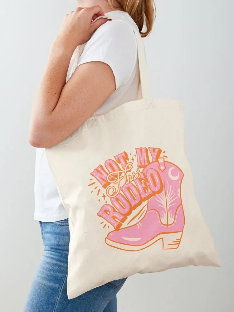 

Not My First Rodeo Pink Cowboy Yeehaw Cowgirl Rodeo Boot Preppy Space Cowgirl Aesthetic Yee Haw HOWDY Y'ALL Pink Backgr Tote Bag