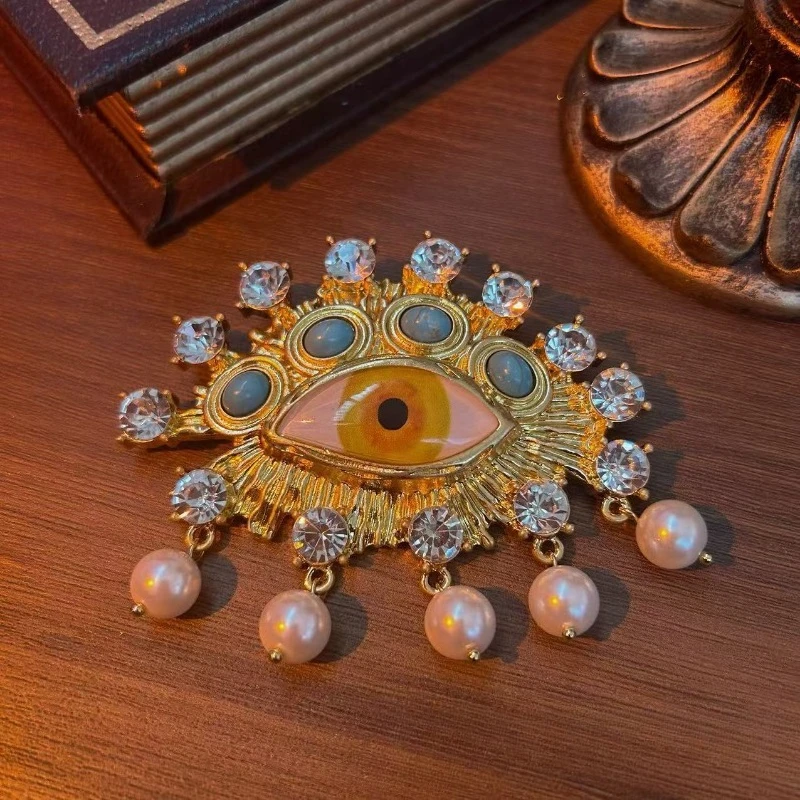 

Mystical Eye Brooch Statement Pin with Pink Iris Blue-Grey Stones Pearl Accents Bohemian Jewelry for Jackets Bags​