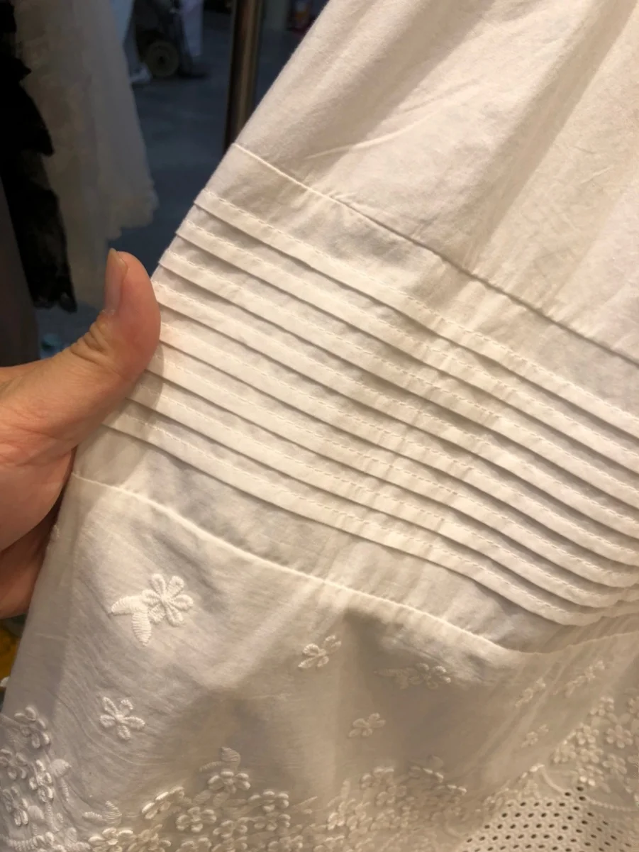 กระโปรงทรงเอเอวสูงปักลายฉลุสีขาวสไตล์เค้กอบสำหรับผู้หญิง กระโปรงมิดิทรงเอ สไตล์หวานๆ สำหรับฤดูใบไม้ผลิ