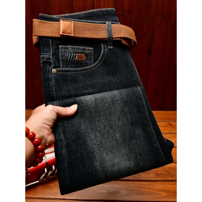 الخريف الراقية الجينز الرجال تصميم الأزياء نسخة ضئيلة صالح مع أقدام صغيرة 2025 الاتجاه الجديد النسخة الكورية السراويل المرنة