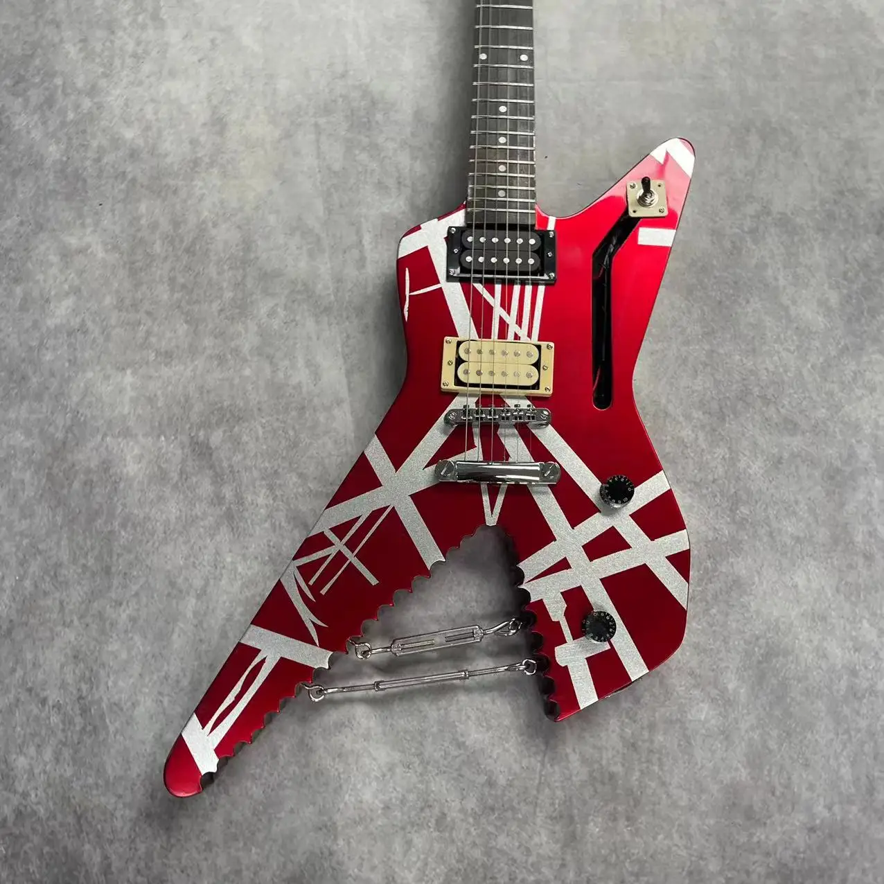 

Electric guitar with 6 strings, metal red body and silver stripes, rose wood fingerboard, maple wood track, real factory picture