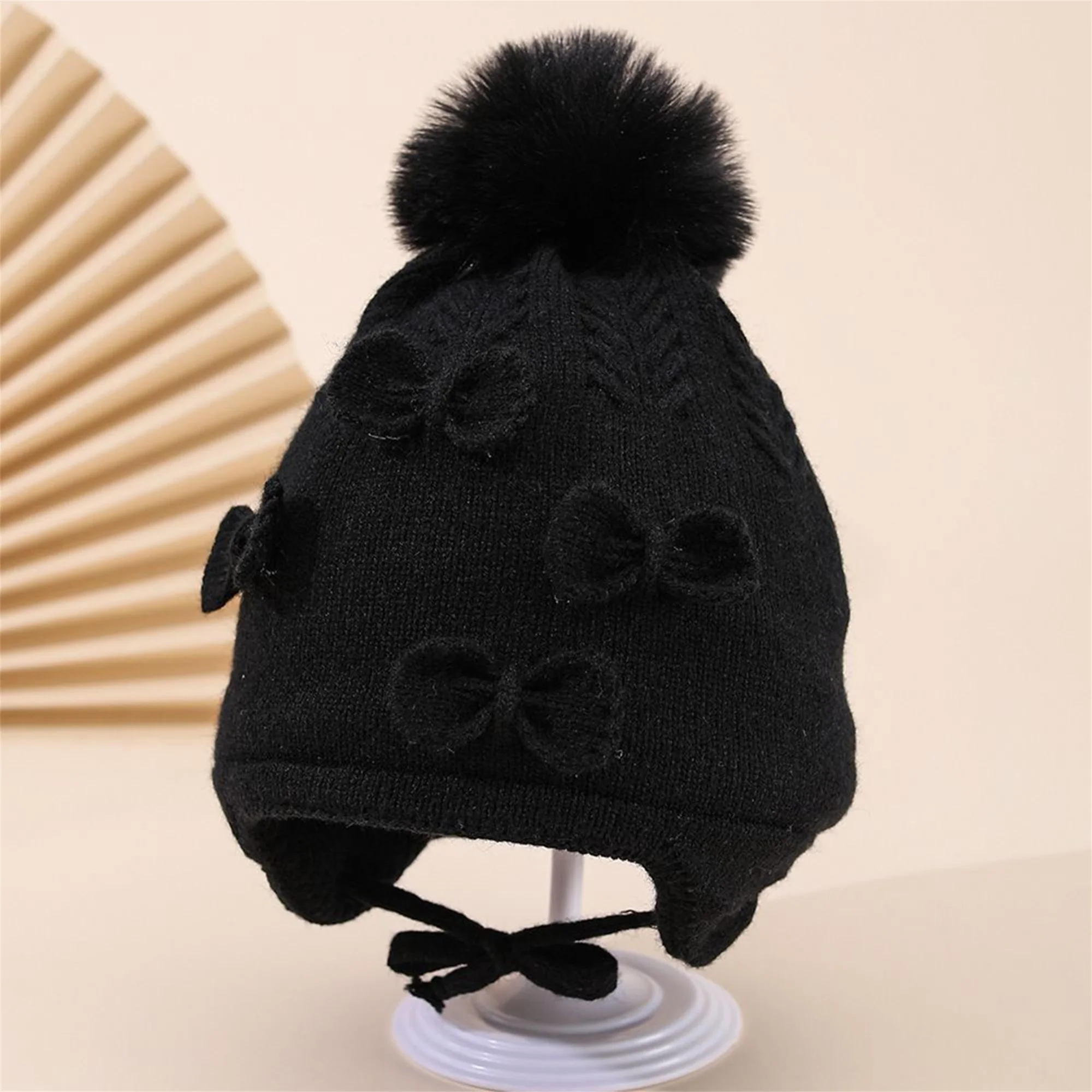 

Cute Baby Girls Pom Pom Knit Hat with Ear Flaps and Bow Detail Cozy Crochet Winter Beanie Cap for Everyday Wear