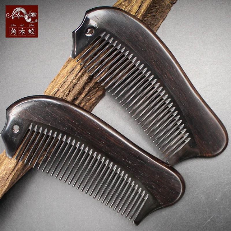 Comb made from hornwood, ebony, and black sandalwood combined with buffalo horn, in the shape of a small fish
