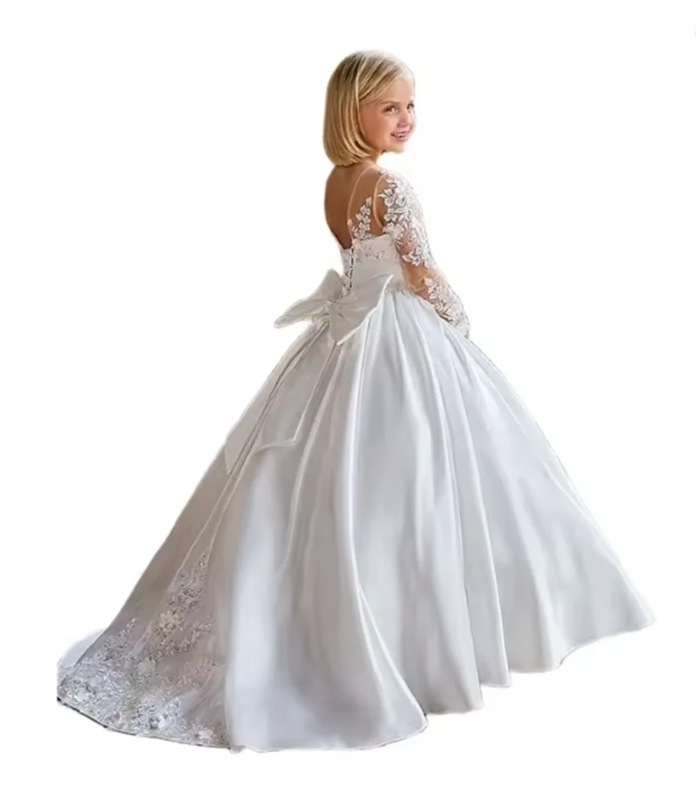 

Princess White Satin Flower Girl Dress: Long, Full Sleeves, Bow Back, Lace Appliques – Perfect for Weddings, First Communion