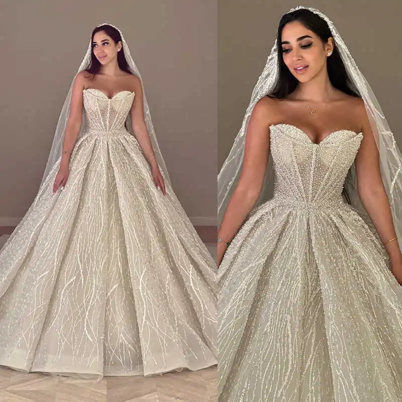 

Роскошное бальное платье Свадебные платья Без бретелек Без рукавов Жемчуг Блестки Платье невесты Плиссированные свадебные платья со шлейфом по индивидуальному заказу