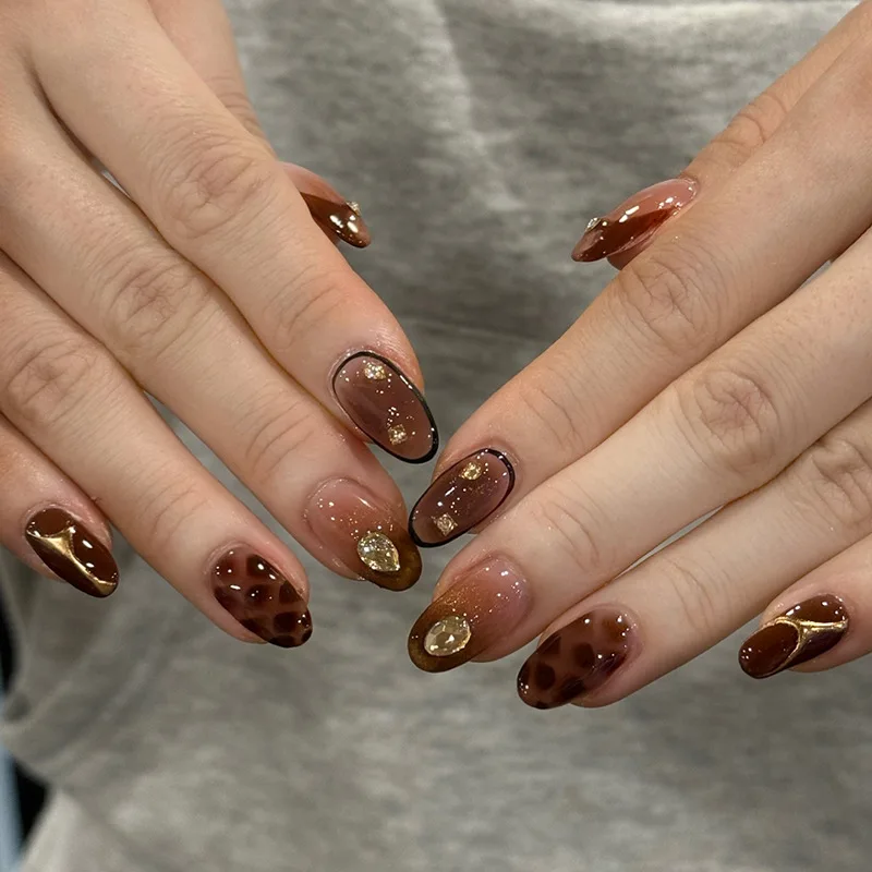 

24pcs Sparkling Golden Brown Cat Eye French Press-On Nails with Diamonds, Short Oval Shape, Assorted Sizes