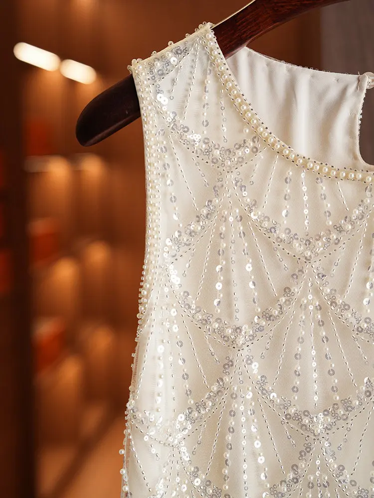 Exquisitely designed, luxurious beaded and sequined women's blouse with a stylish, sleeveless aesthetic vest