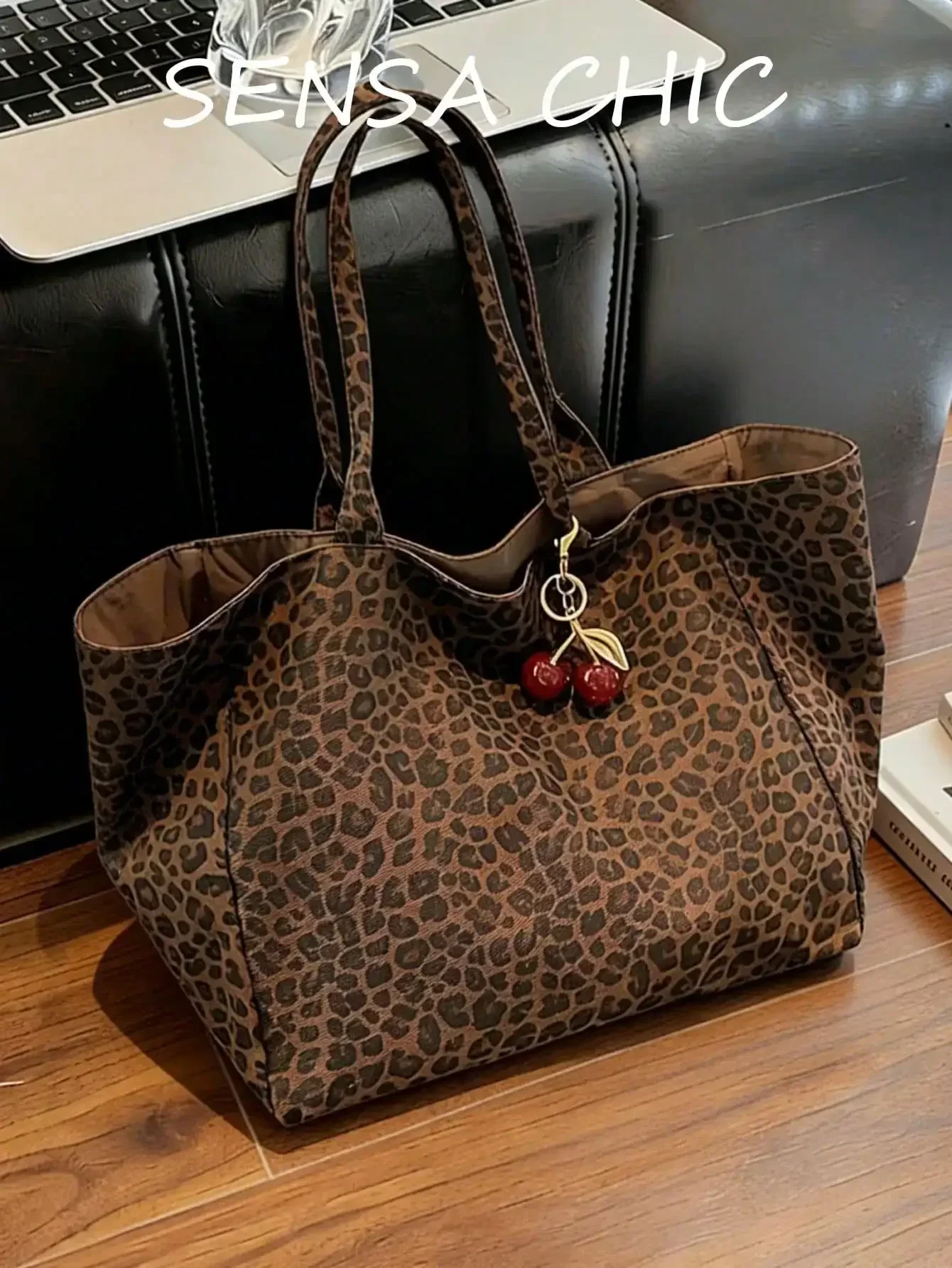 Large Capacity Women's Brown Tote Bag With Red Cherry Pendant. Featuring Leopard Print Design And Sturdy Dual Top Handles