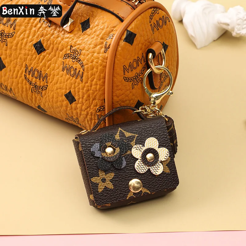 Miniso leather flower earphone case keychain pendant, cute monogram girl bag key chain