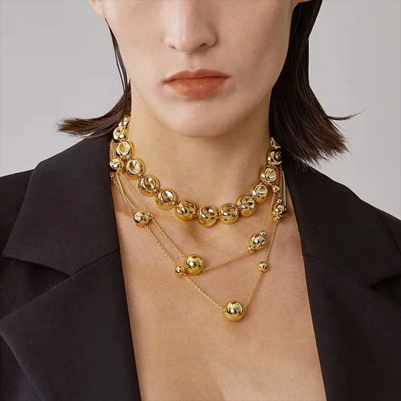 Niche design irregular concave golden ball long necklace light luxury high-end layered sweater chain women's fashion accessory